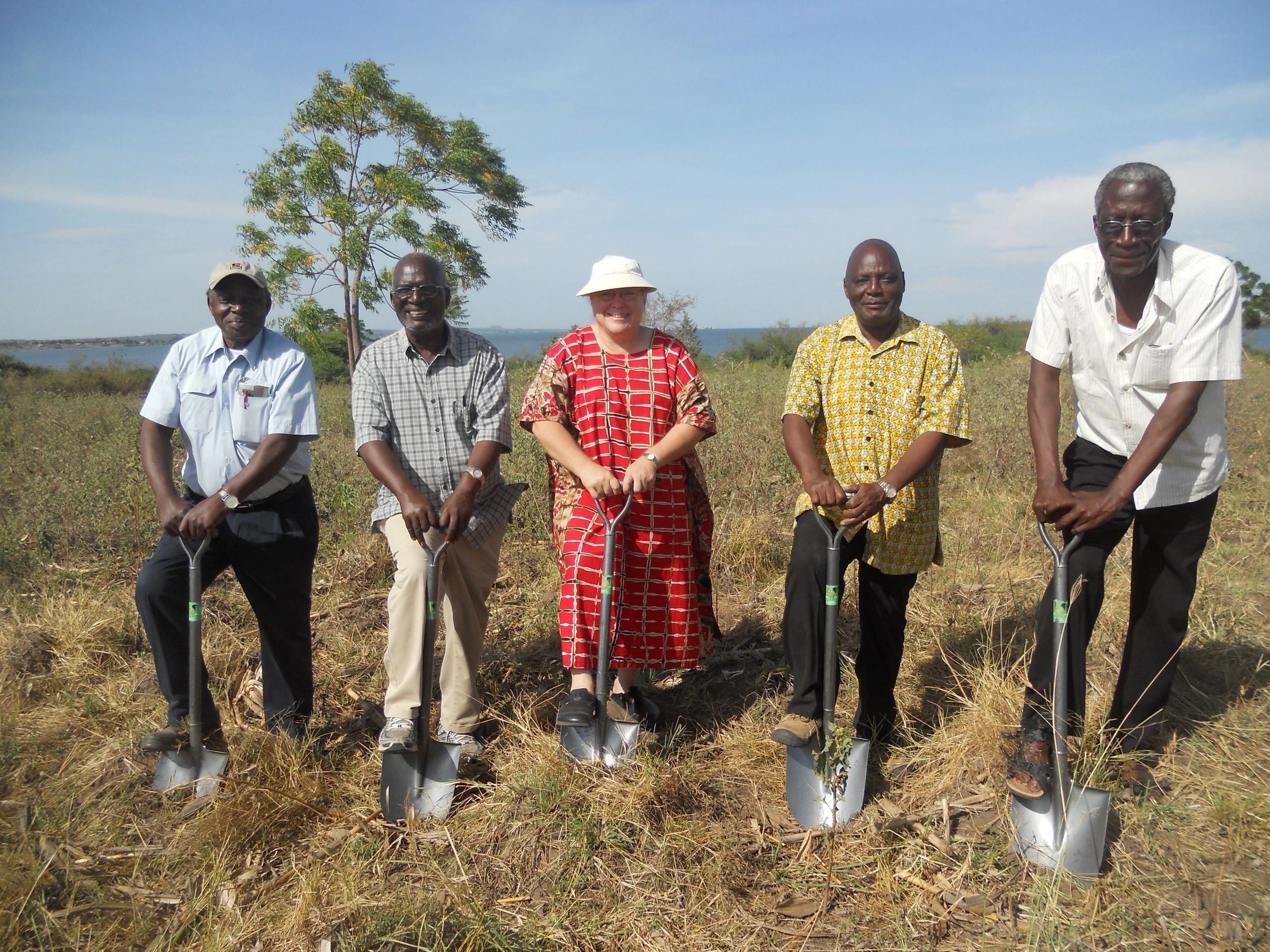 Community leaders and partners at groundbreaking near Lake Victoria